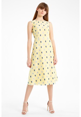 Яскрава жовта сукня міді