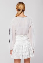 Ніжна молочна міні-спідниця